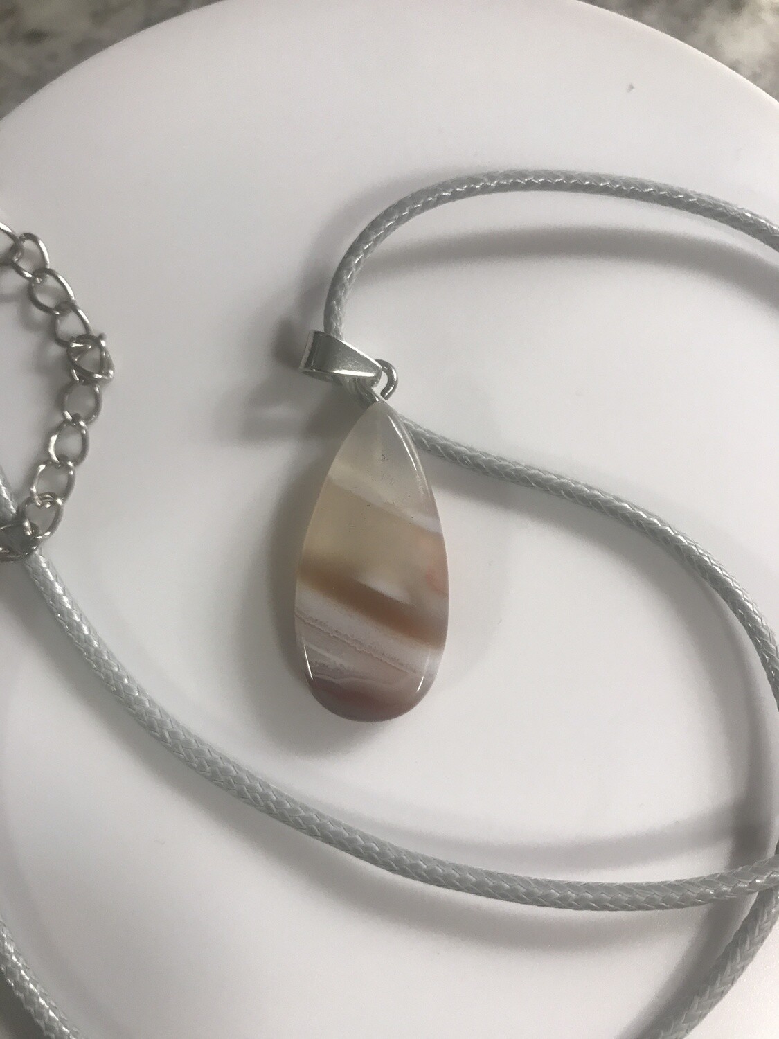 Crystal stone pendant on wax cord