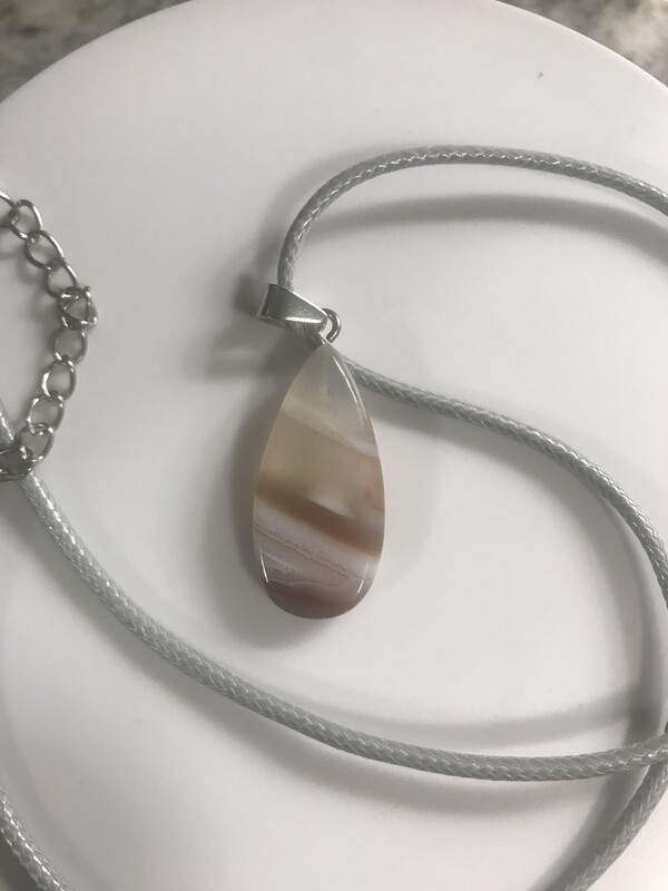 Crystal stone pendant on wax cord