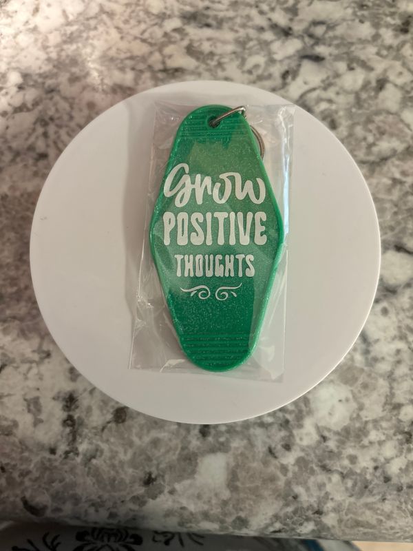 Green motel keychain Grow Positive Thoughts