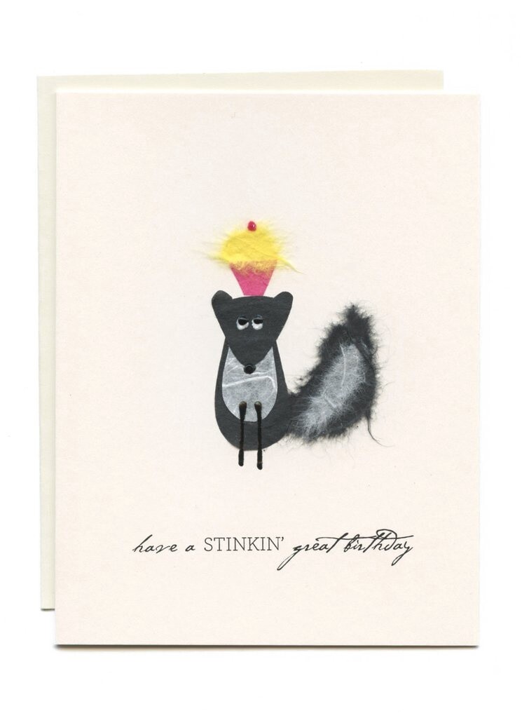 SKUNK W CUPCAKE