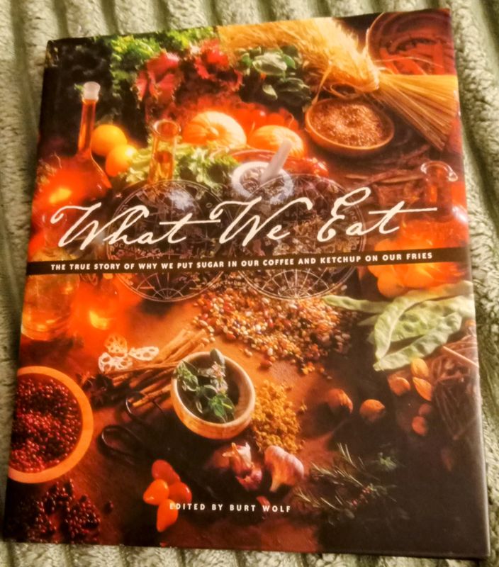 &quot;What We Eat: The true story of why we put sugar in our coffee and ketchup on our fries&quot; edited by Burt Wolf.  Hardcover (Pre-owned, excellent-like brand new condition)