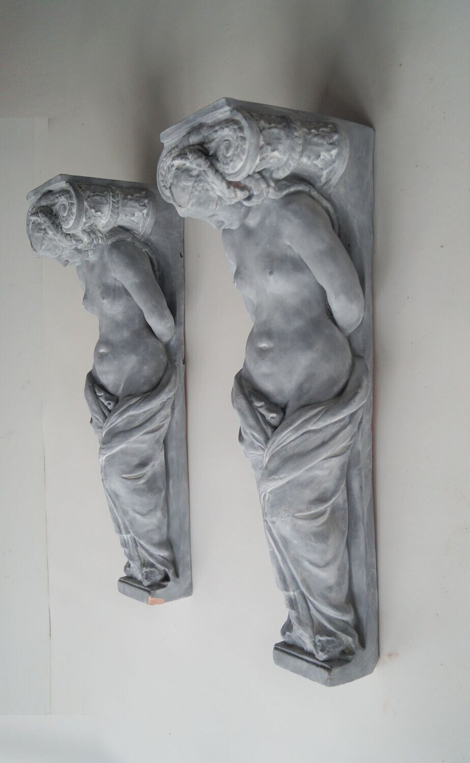 Set of two terracotta clay caryatids