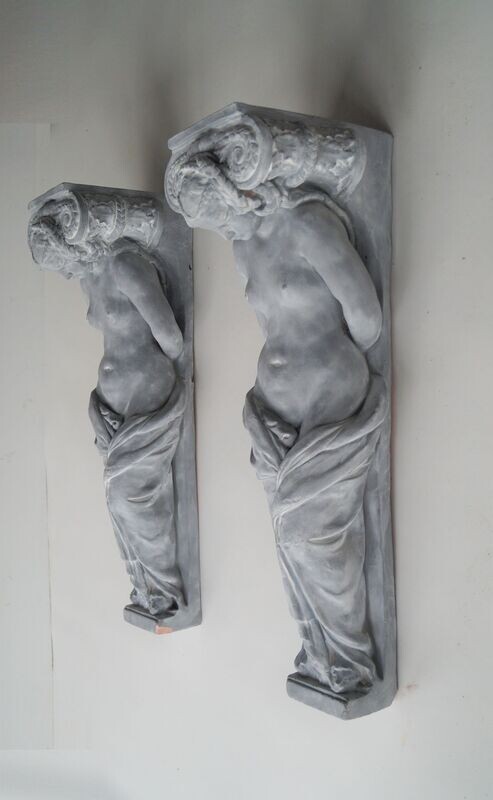 Set of two terracotta clay caryatids