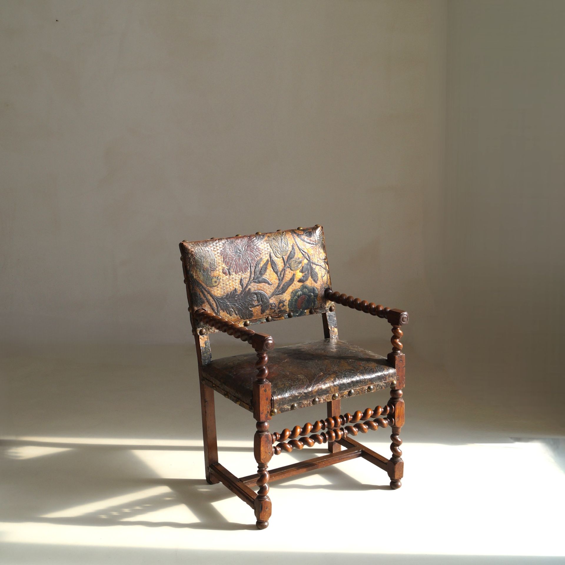 Late 17th Century Flemish Walnut Armchair with later Gilt Cordoba Leather