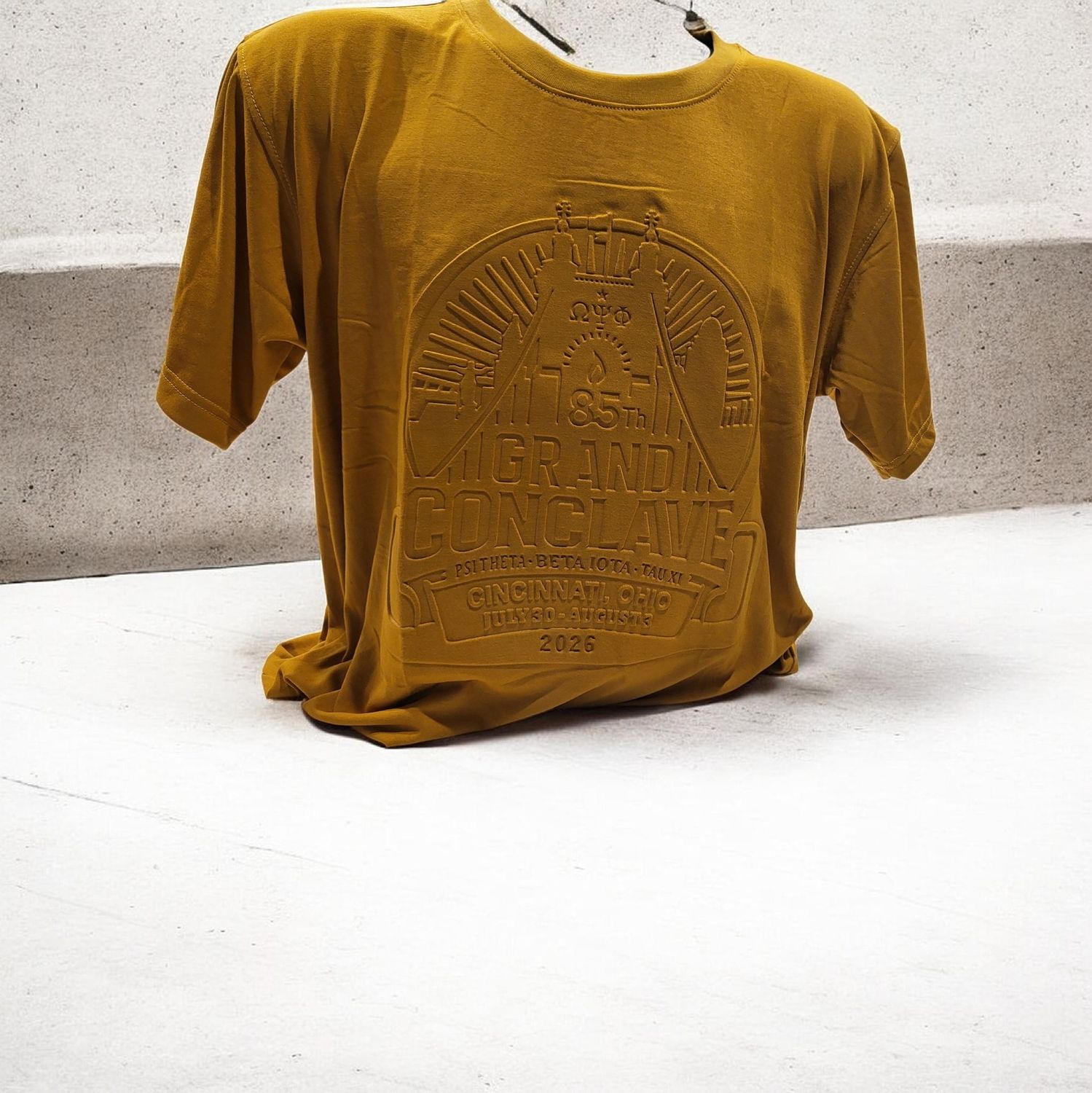 Omega Psi Phi 2026 EMBOSSED Gold shortsleeve Conclave shirt