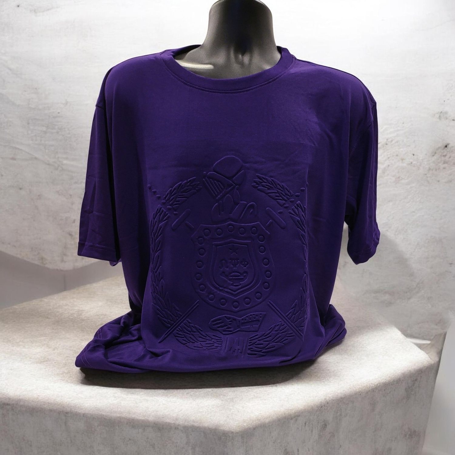 0mega Psi Phi Purple EMBOSSED Shield Shortsleeve