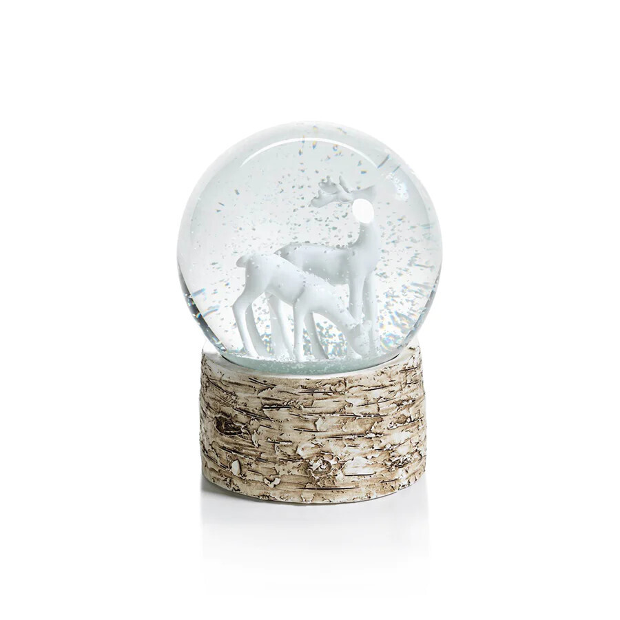 Snow globe on birch with reindeers