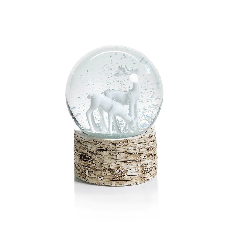 Snow globe on birch with reindeers