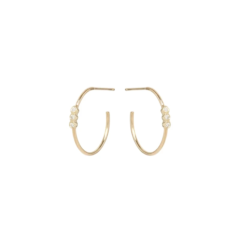 Earrings- 14k small hoops with 3 bezel set 1.3mm diamonds in the middle (.06 ctw)..