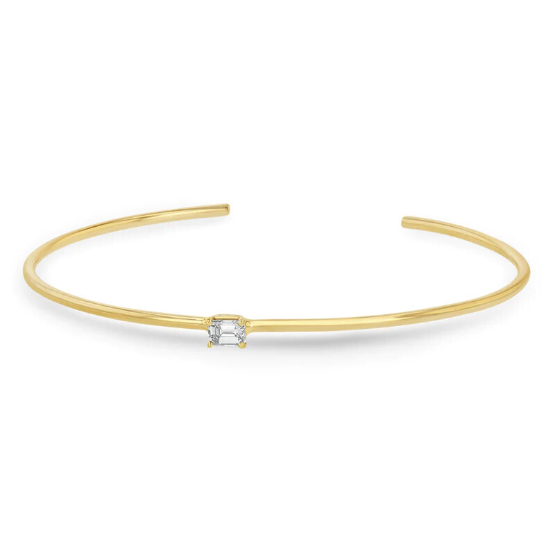 Bracelet- 14k cuff w prong set emerald cut dia