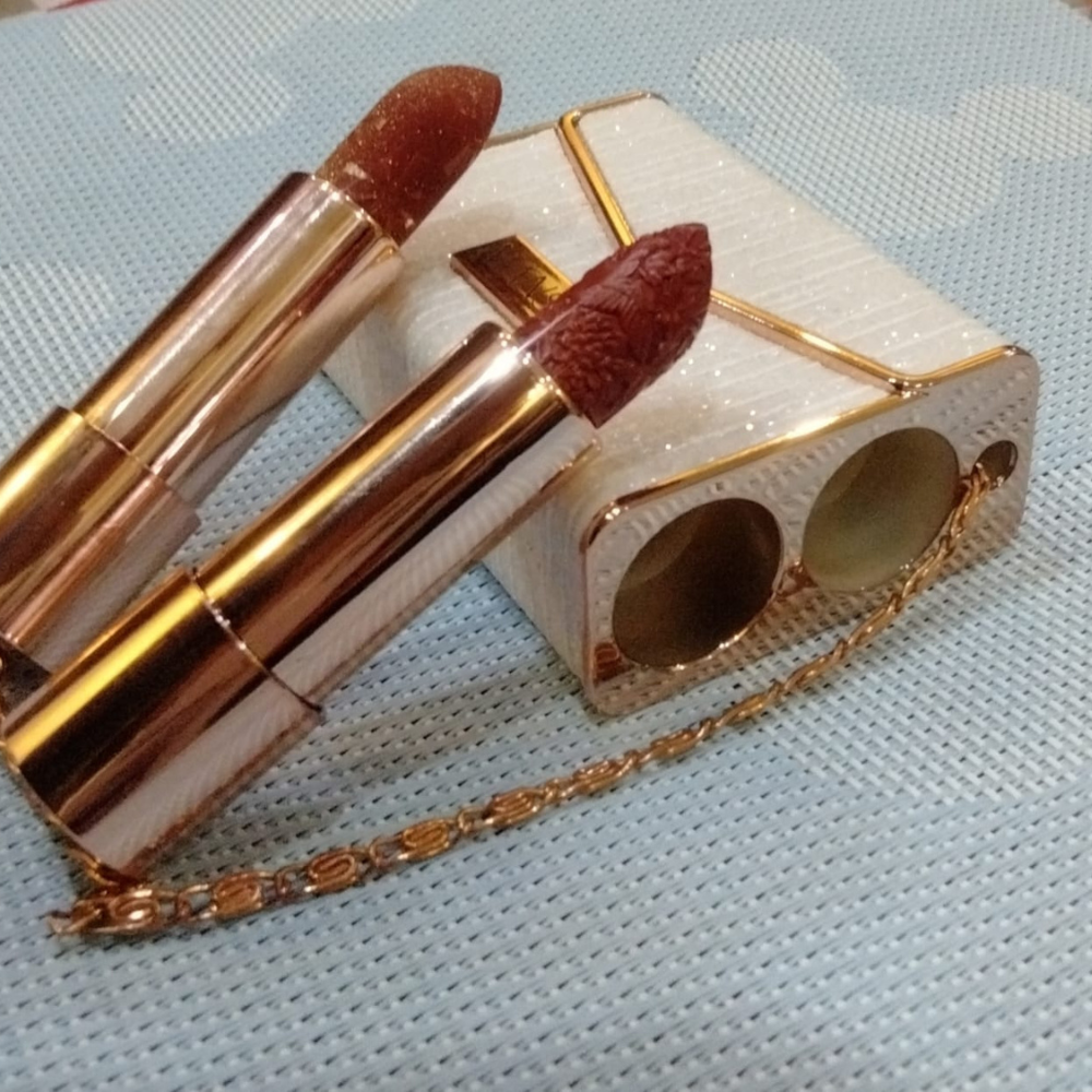 Two gorgeous red lipsticks in a little portable sparkling mettle bag(as a holder lid)