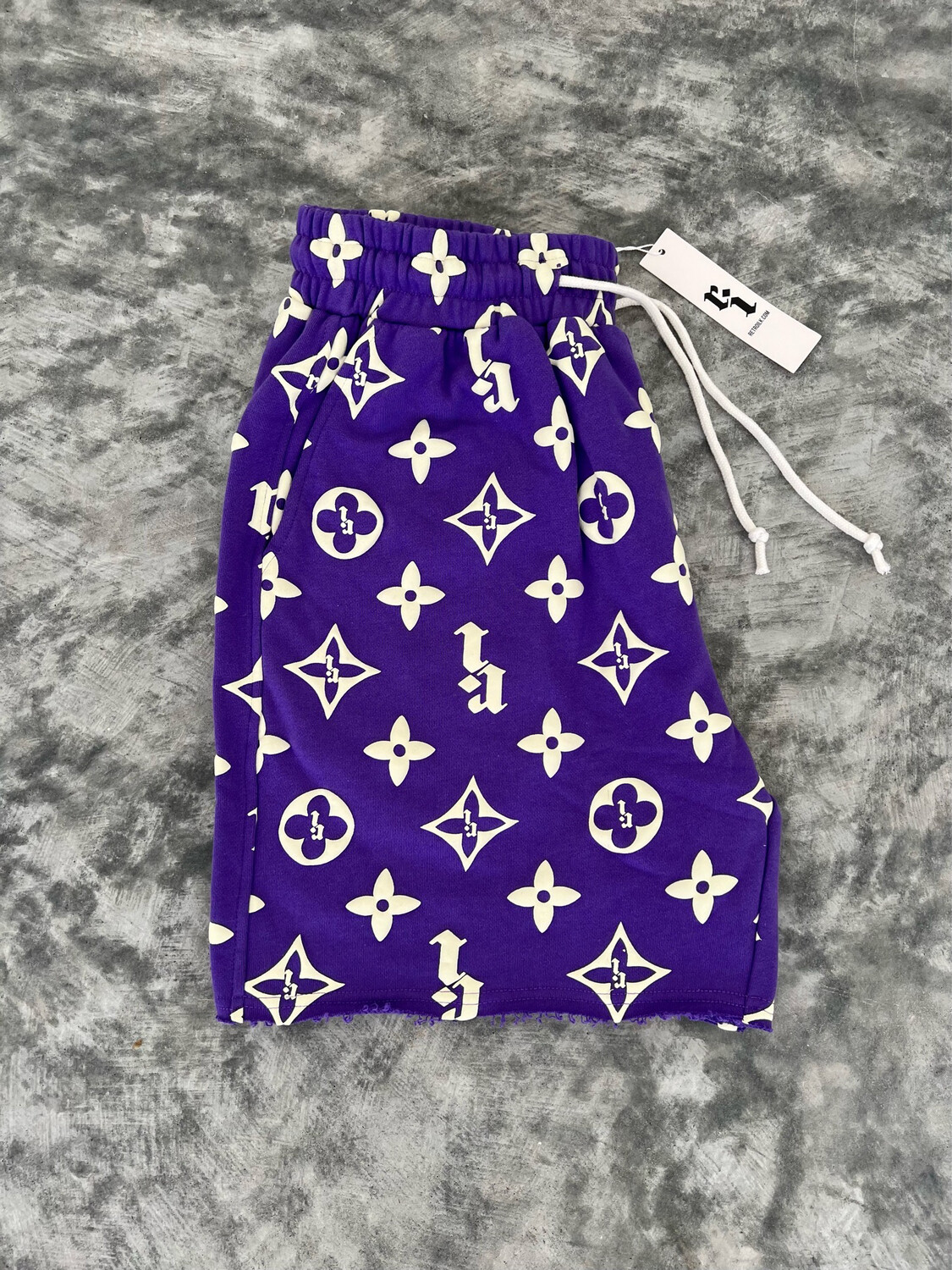 PURPLE “RI” PUFF PRINT SHORTS