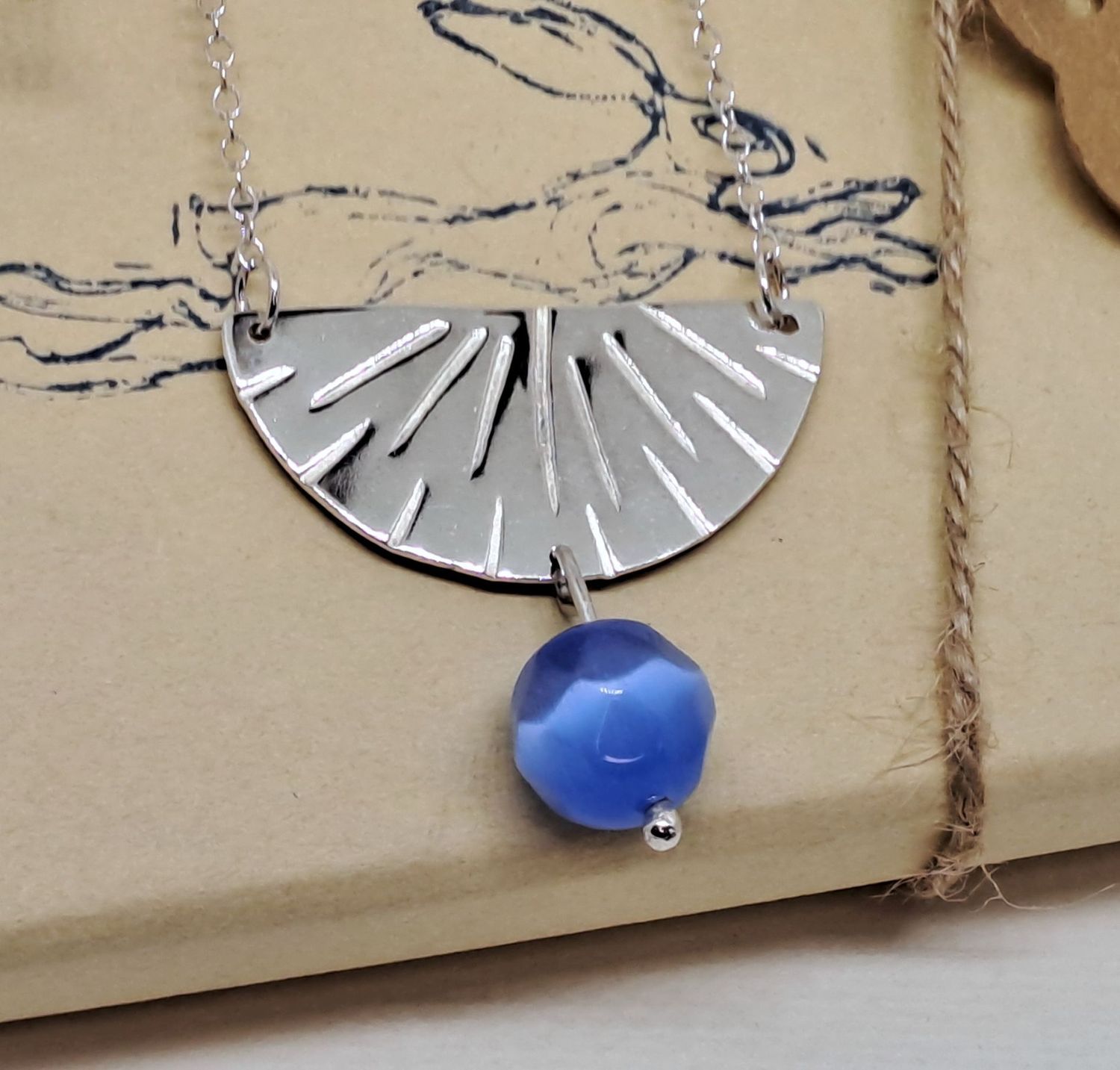 FAN PENDANT WITH BEAD