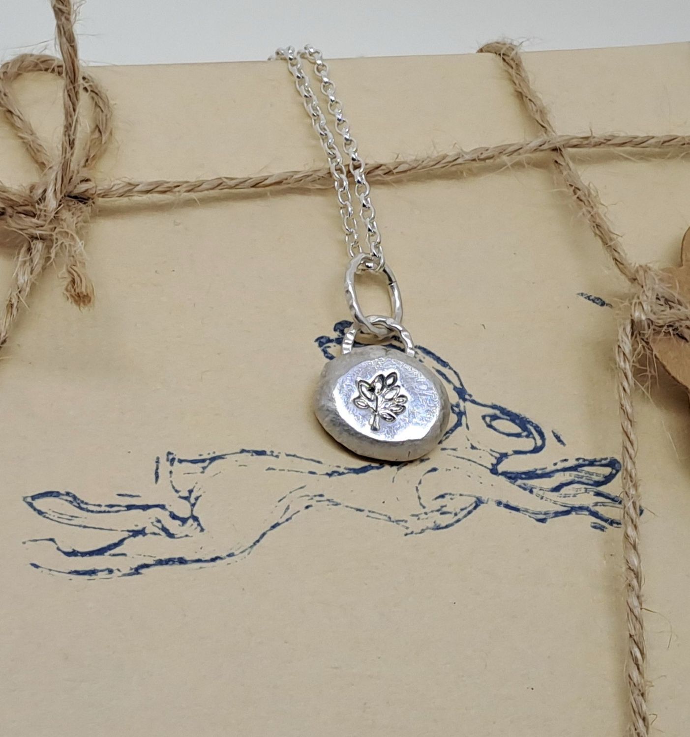 SILVER PEBBLE WITH TREE OF LIFE