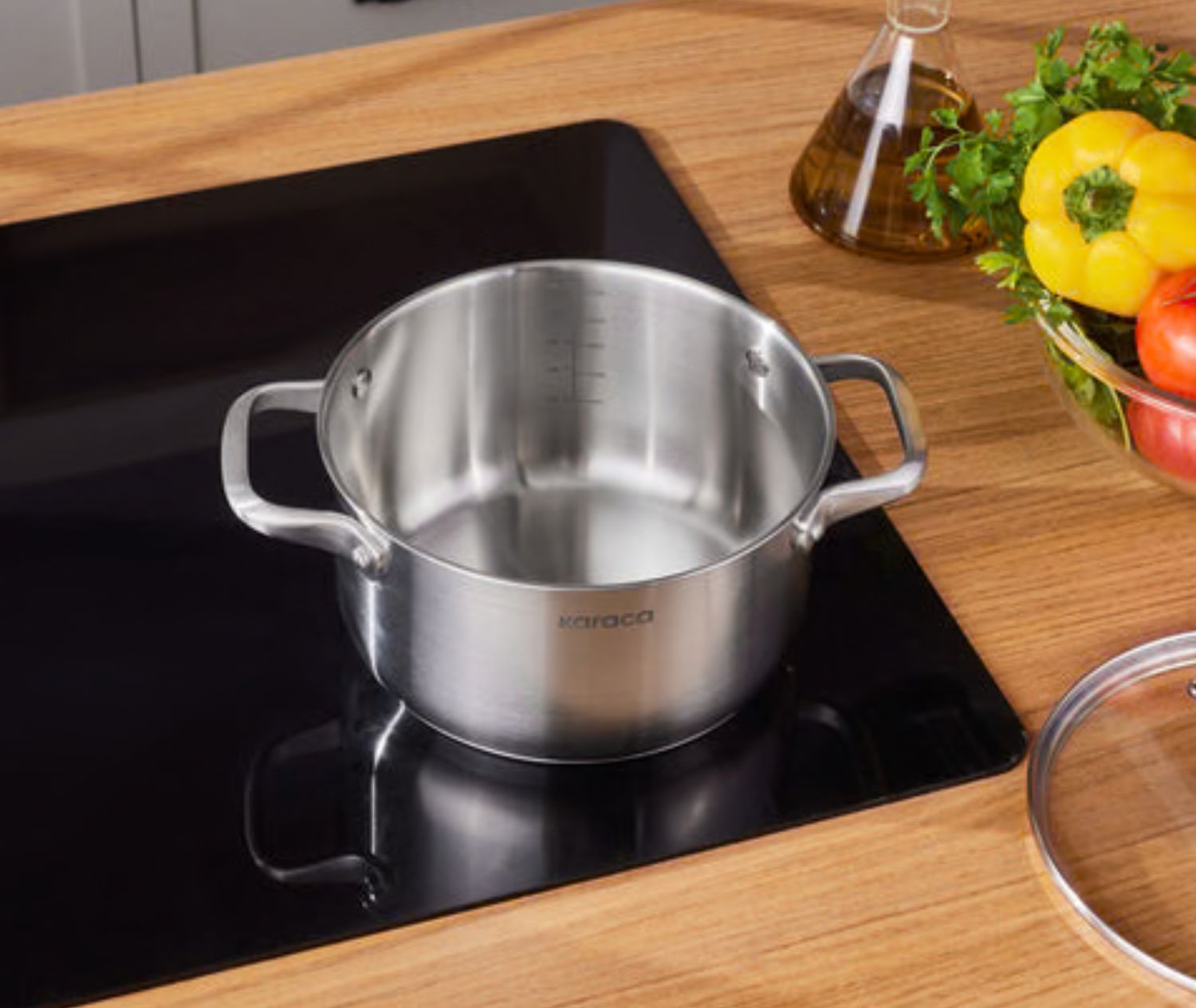 Karaca Elite roestvrijstalen inductie kookpot met deksel, 20 cm, zilver Karaca Elite roestvrijstalen inductie kookpot met deksel, 20 cm, zilver