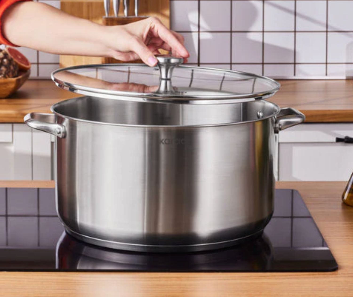 Karaca Elite roestvrijstalen inductie kookpot met deksel, 34 cm, zilver Karaca Elite roestvrijstalen inductie kookpot met deksel, 34 cm, zilver