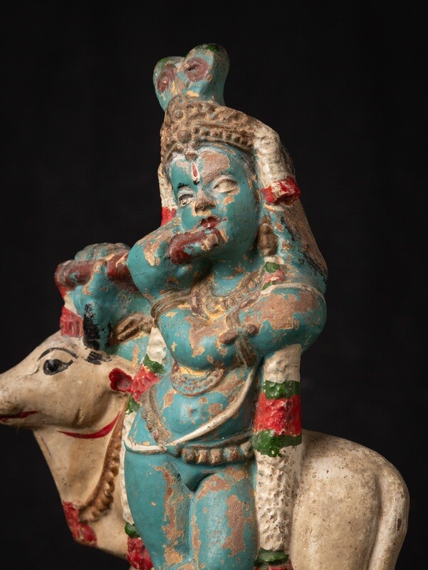 Antiek aardewerk Krishna beeld met Nandi
