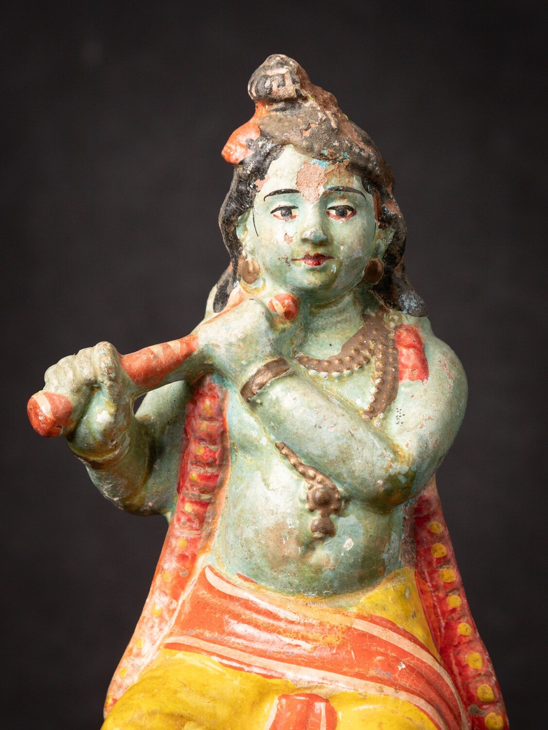 Antiek Krishna beeld