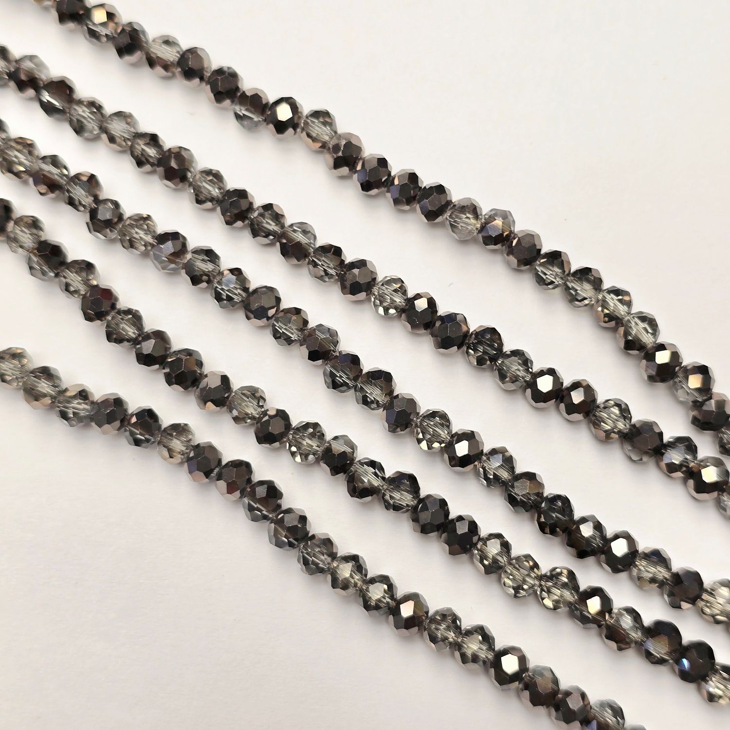 6mm Rondelle: Half Hematite/Black Crystal Strand 6mm Rondelle: Half Hematite/Black Crystal Strand