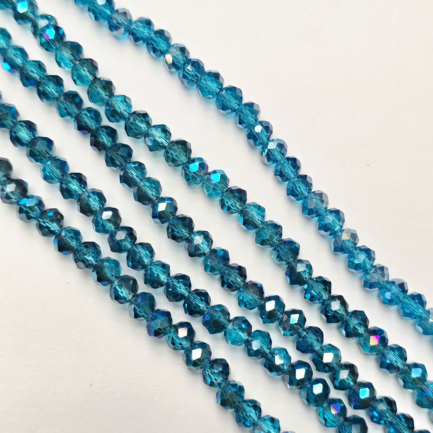 6mm Rondelle: Medium Aquamarine AB Crystal Strand 6mm Rondelle: Medium Aquamarine AB Crystal Strand