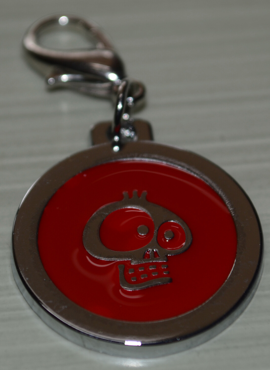 Tag Red with Silver Skull on circle shape