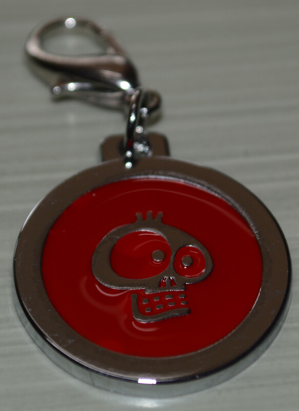 Tag Red with Silver Skull on circle shape