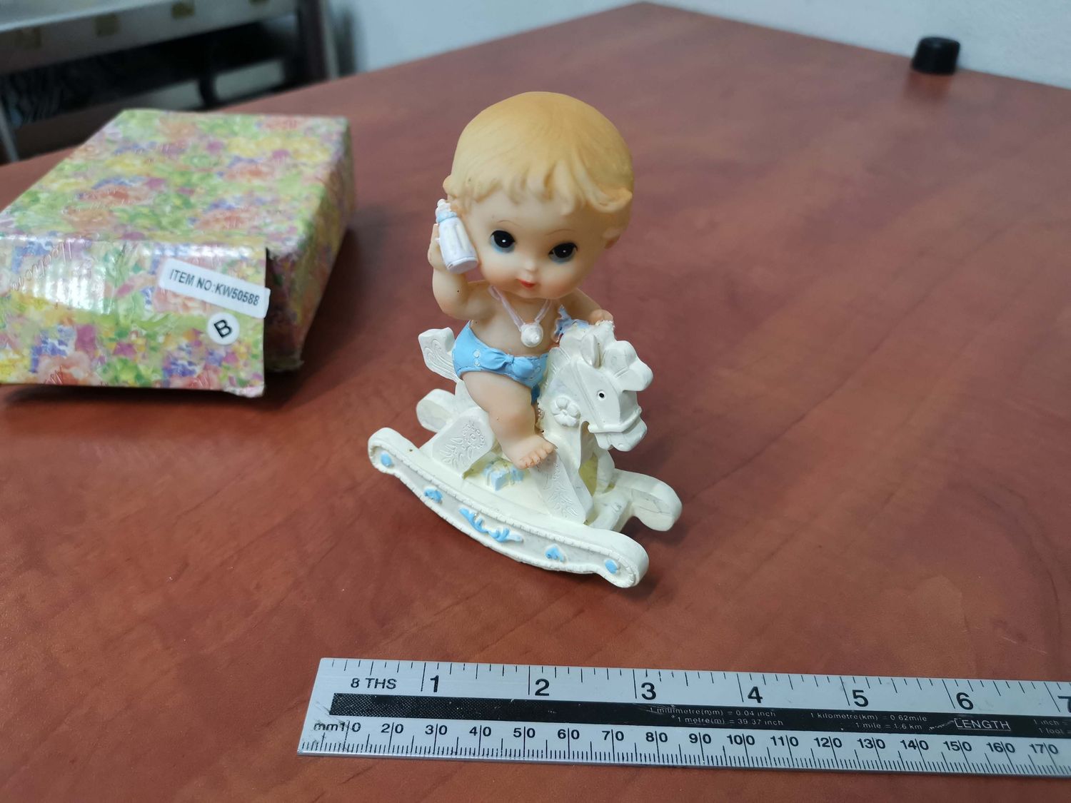 Porcelain baby on horse blue