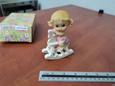 Porcelain baby on horse pink