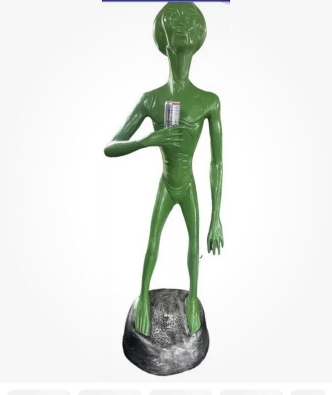 Alien Standing holding a drink Alien Standing holding a drink