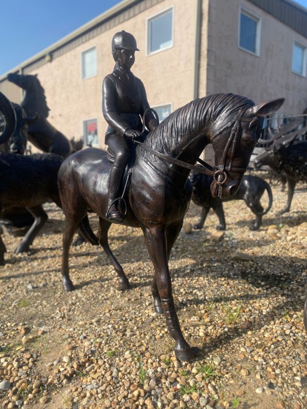 Horse with girl jockey
