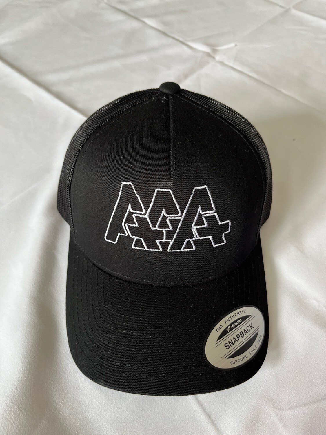 Black-White Trucker Triple A Logo