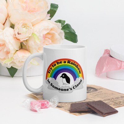Try to be the rainbow in someone's cloud Mug