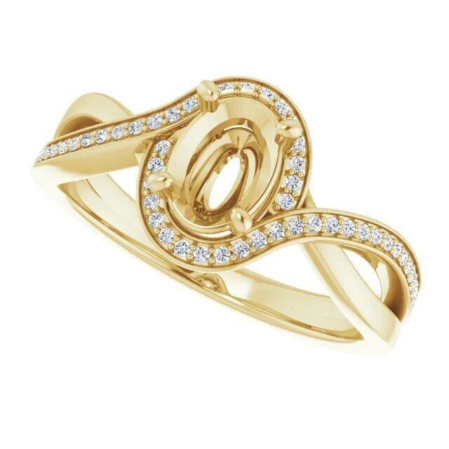 Stuller. 14k Gold Setting With 54 Small Diamonds, Made for a 7x5mm Centre Stone.
