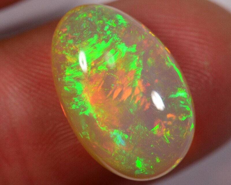 Size 7 Opal Ring. 7.1 carat Opal . Appraised Retail Replacement: $1650 Excellent fire.