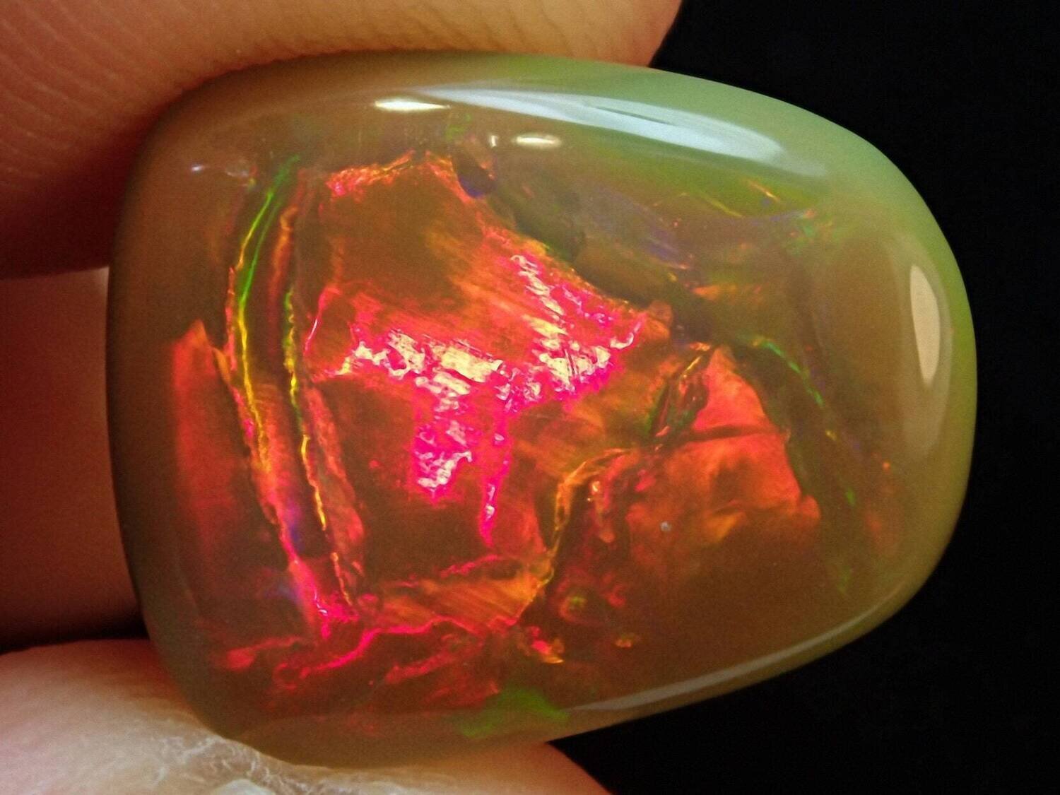 Opal. 6.3 carats. Natural Earth Mined . Dark Base. Appraised Retail Replacement: $750