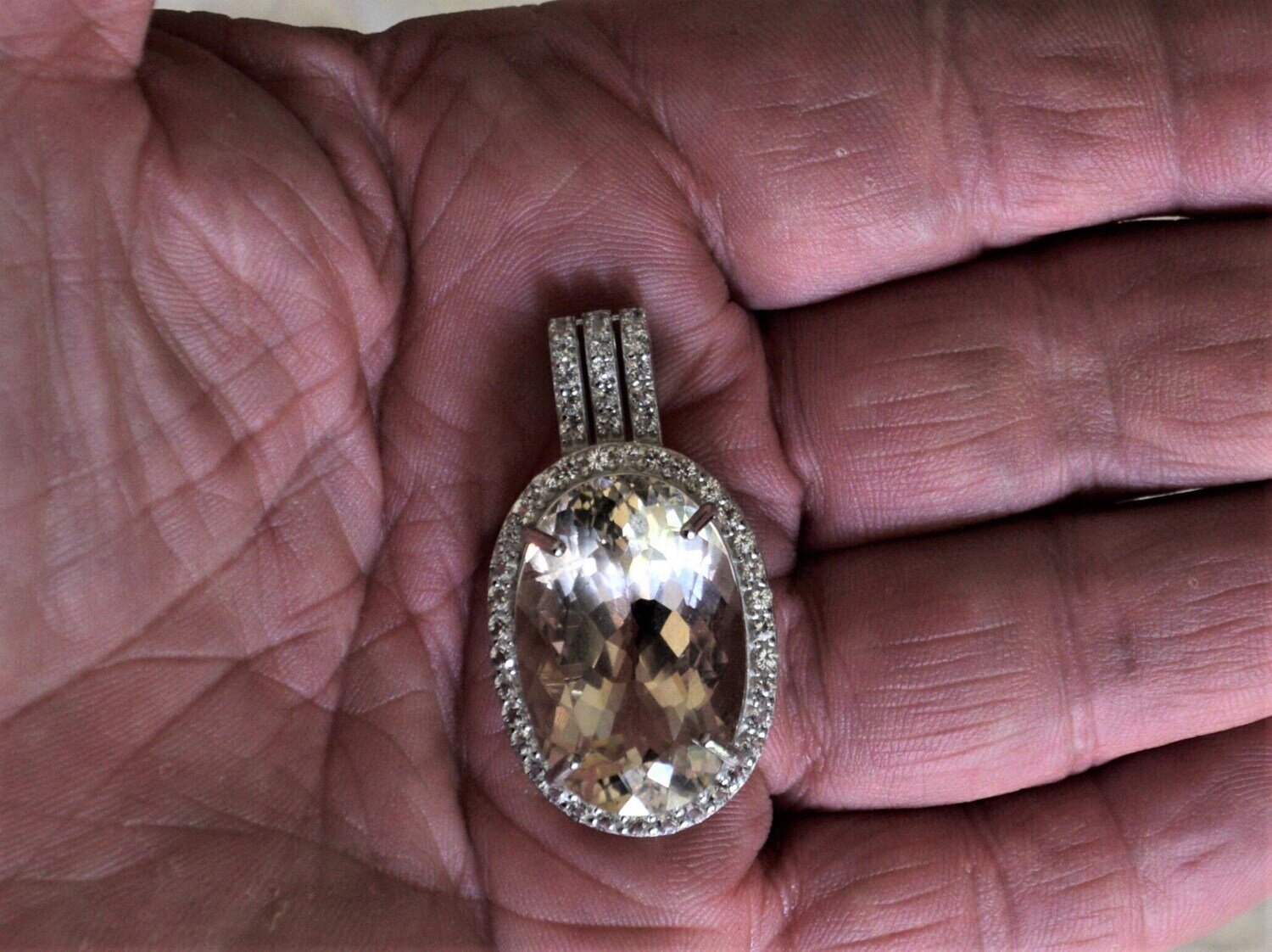 Topaz Pendant. 49.16 cwt. Topaz  .Independent MasterValuer Appraised for $2,210.  27.2x18.2x13.3mm. See Video