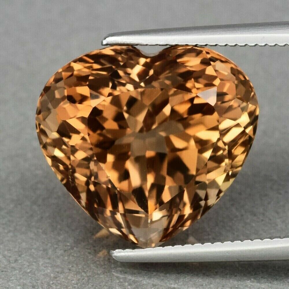 12.35 cwt. Yellow Topaz Heart . Earth Mined .  13.6x12.6x10.2 mm. See Video