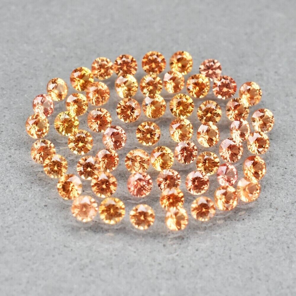 Melee Sapphire Stones Yellowish Orange.  Approx 1.5 cwt total weight.  1.6 mm rounds.  56 stones. See Video
