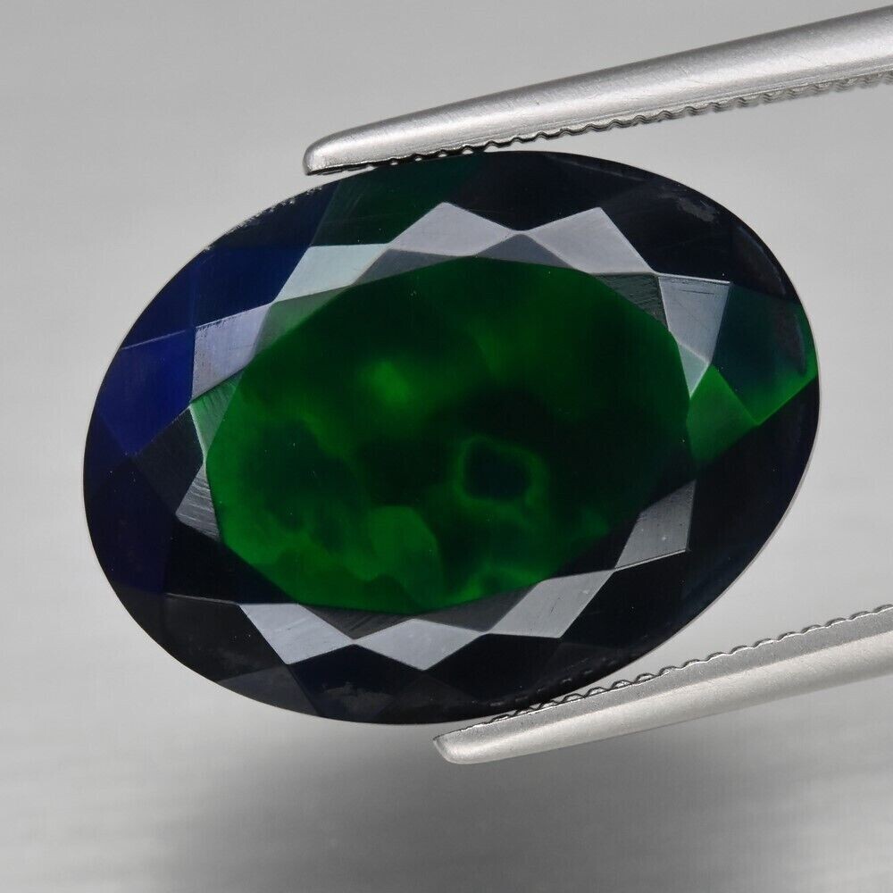 Opal . Approx. 6.4cwt.  Green and Blue flash. 15.2x11.3x9.1mm . Oct. Birthday. See Video