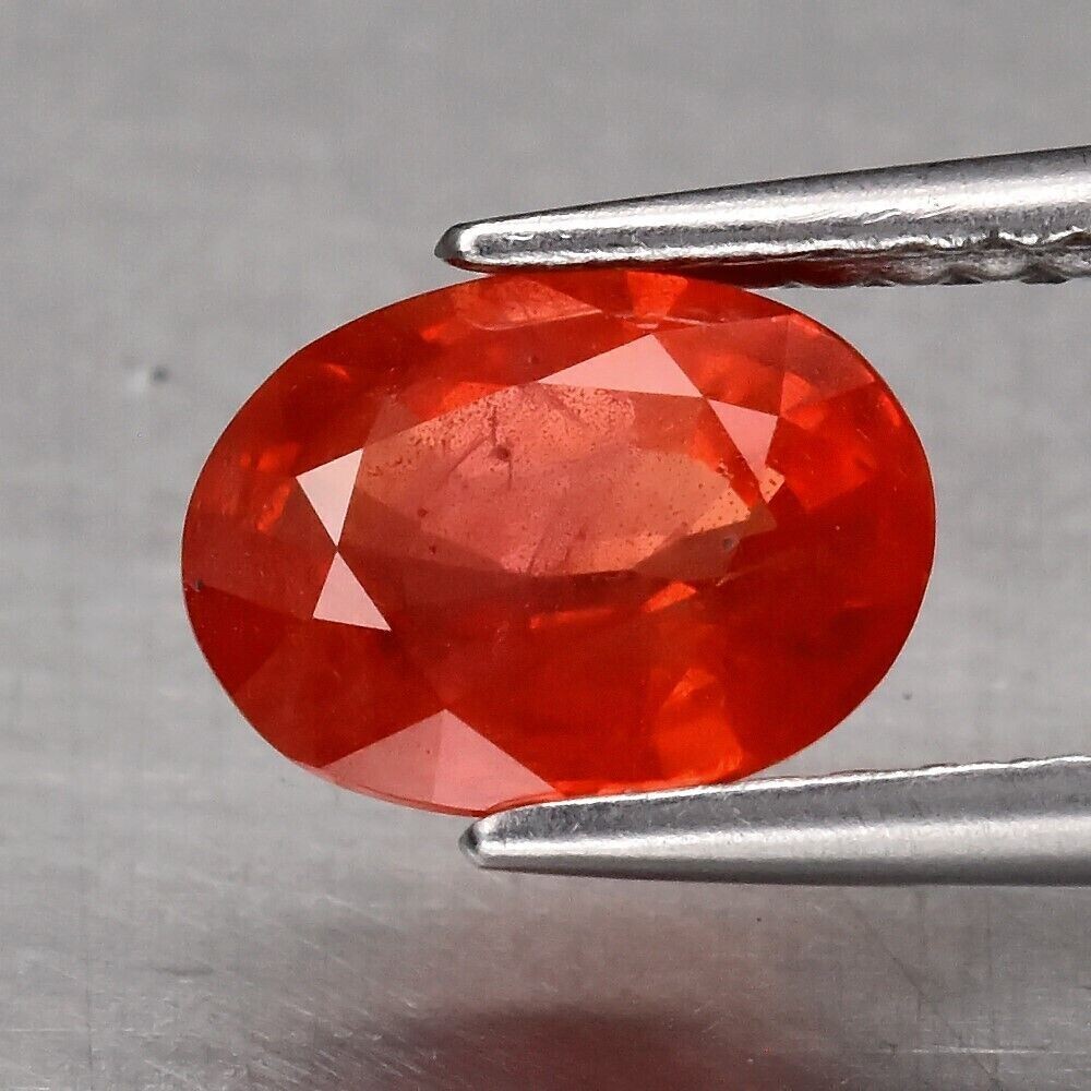 Earth Mined  Sapphire, Orangy Red.  Approx.  1.45cwt. 7.7x5.7x3.6mm. September Birthday. See Video.