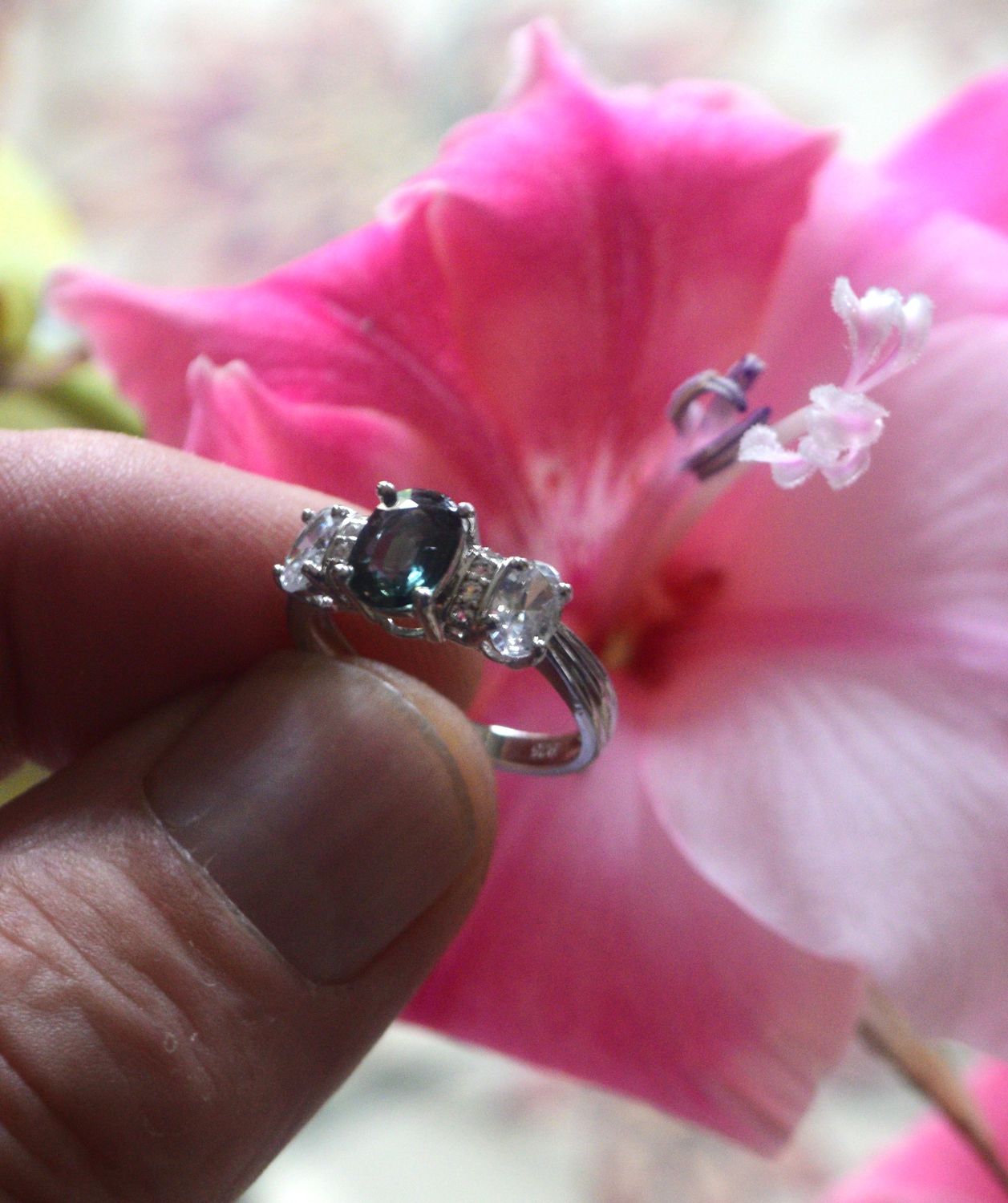 Size 7 Ring. Sapphire, Bluish Green. Approx.  1.5cwt.  Natural Earth Mined 8x6x3mm. See Video