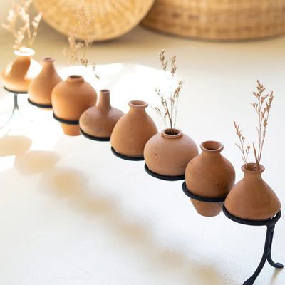 Clay Vessels On An Iron Base