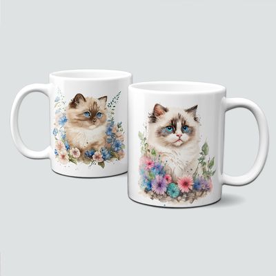 Tasse mit Katzenkindern umgeben von Blumen