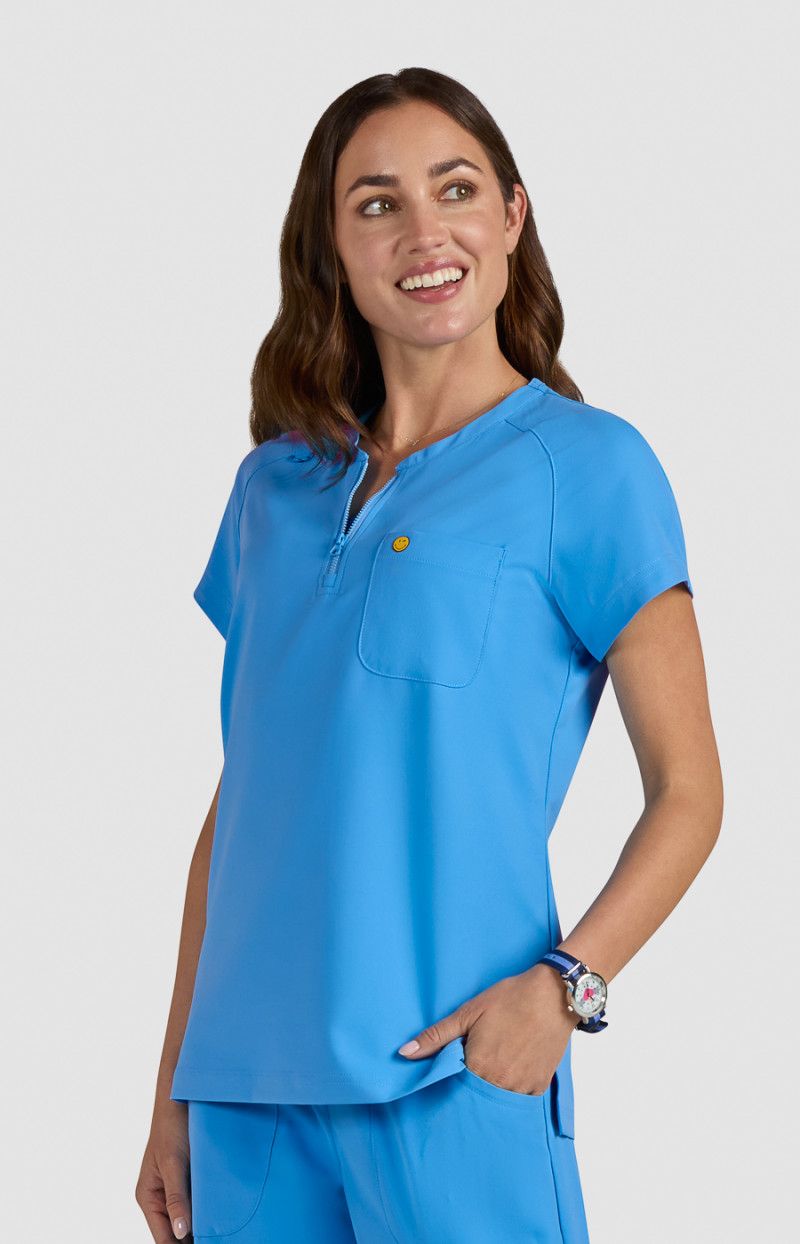 koi | SmileyWorld Ecstatic Women&#39;s 1-Pocket Zipper-Neck Scrub Top