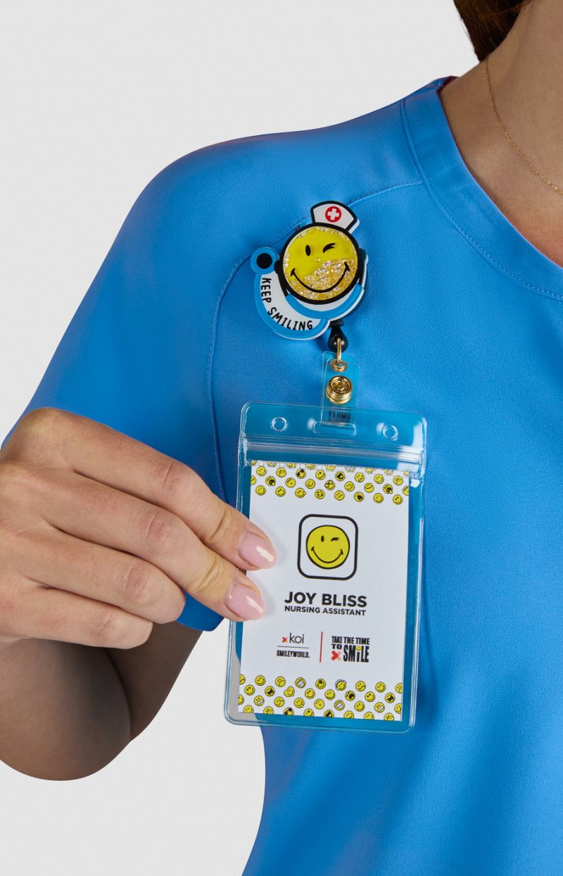koi | SmileyWorld Ecstatic Women&#39;s 1-Pocket Zipper-Neck Scrub Top
