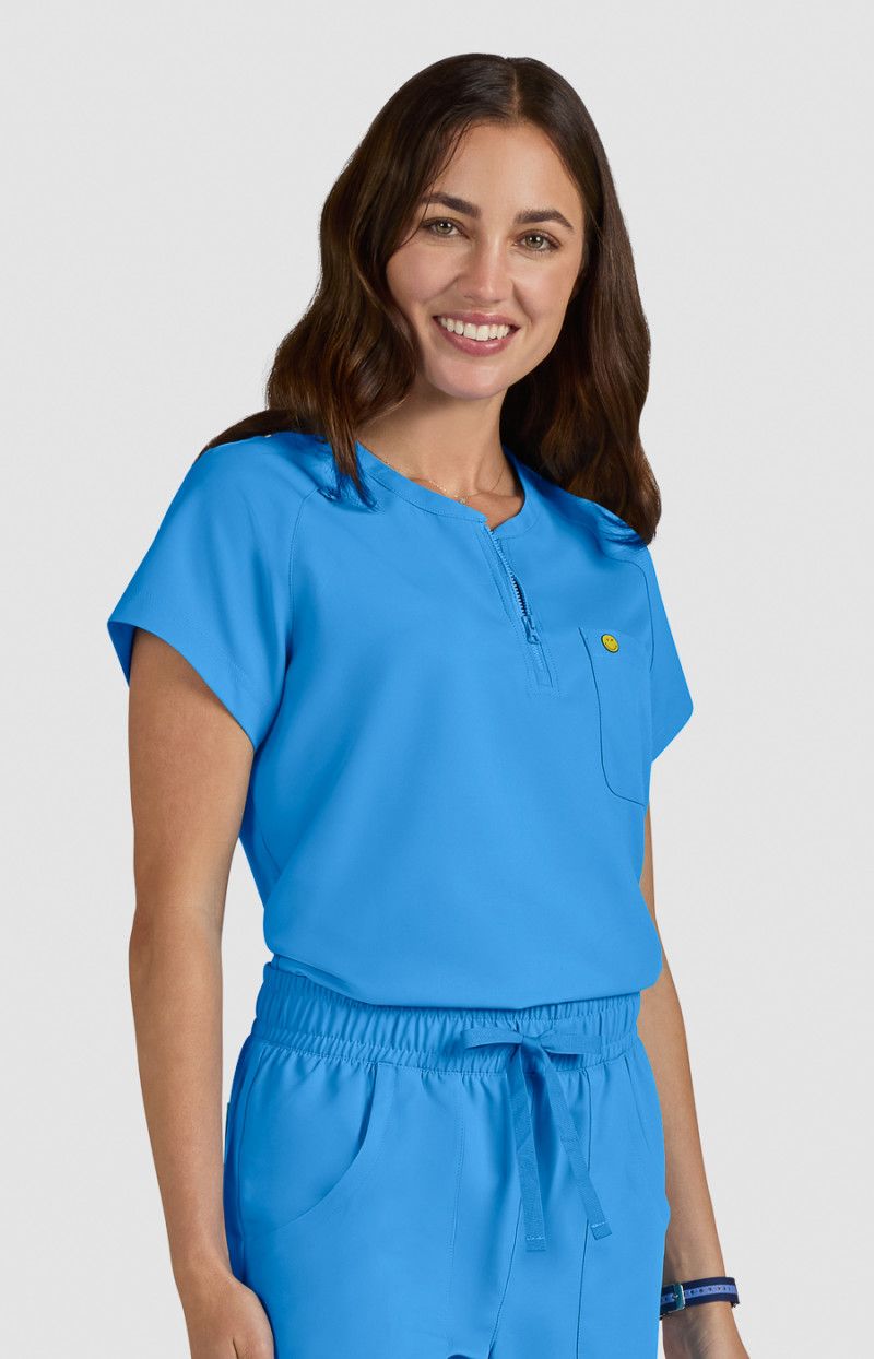 koi | SmileyWorld Ecstatic Women&#39;s 1-Pocket Zipper-Neck Scrub Top