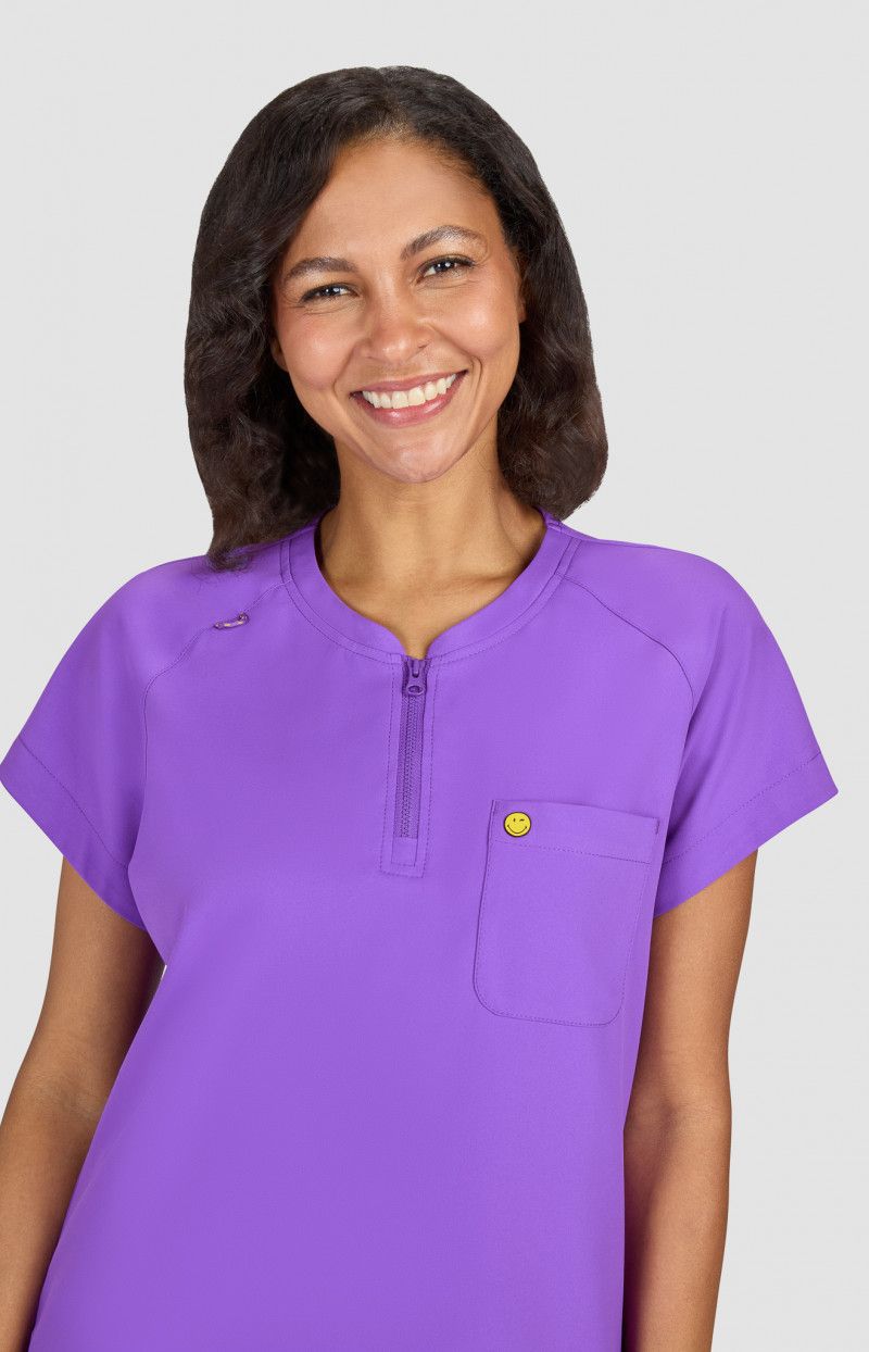 koi | SmileyWorld Ecstatic Women&#39;s 1-Pocket Zipper-Neck Scrub Top