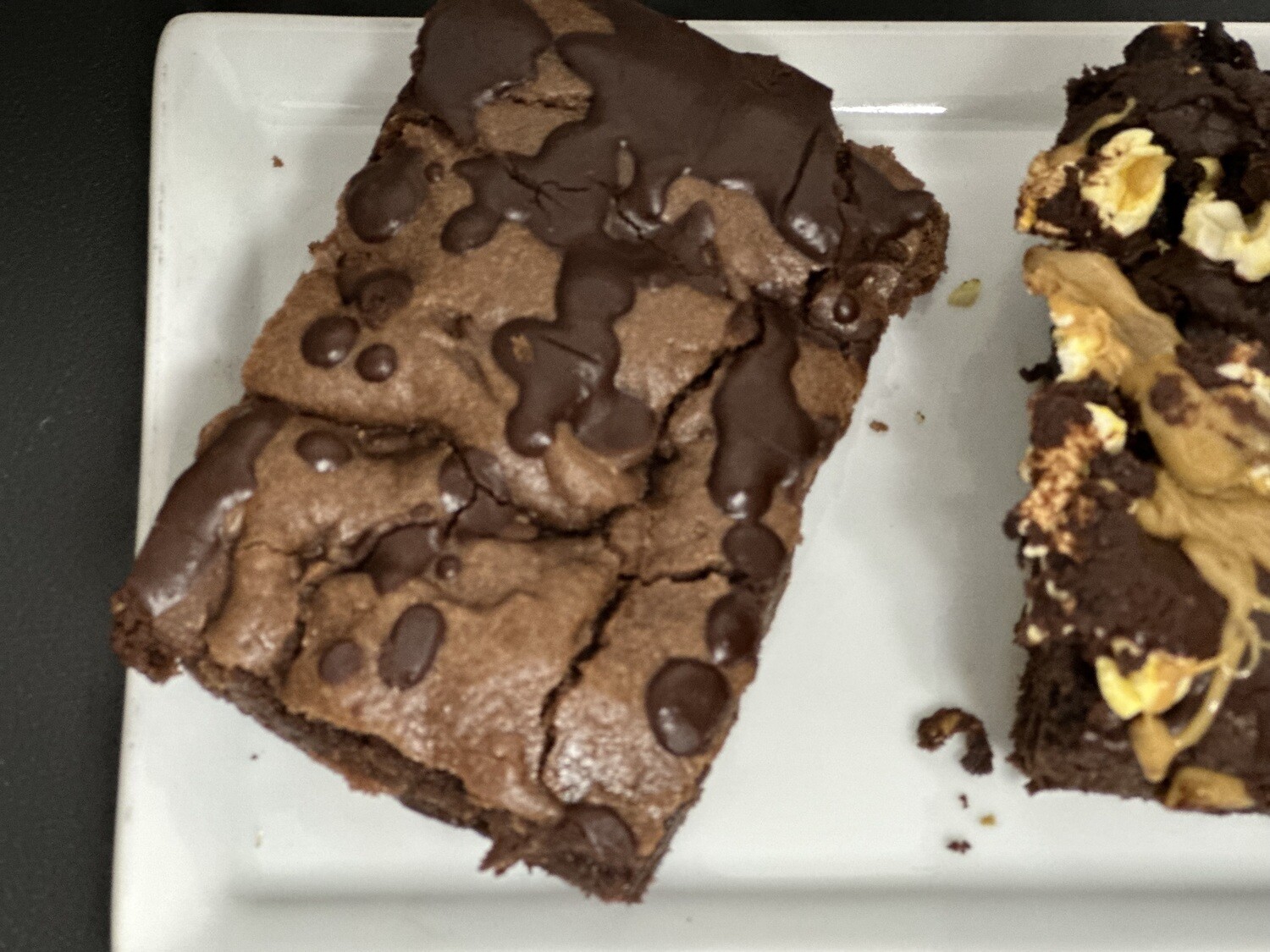 Traditional chocolate chip brownies with chocolate ganache drizzle,3D movie &amp; Dark chocolate with pecans chopped