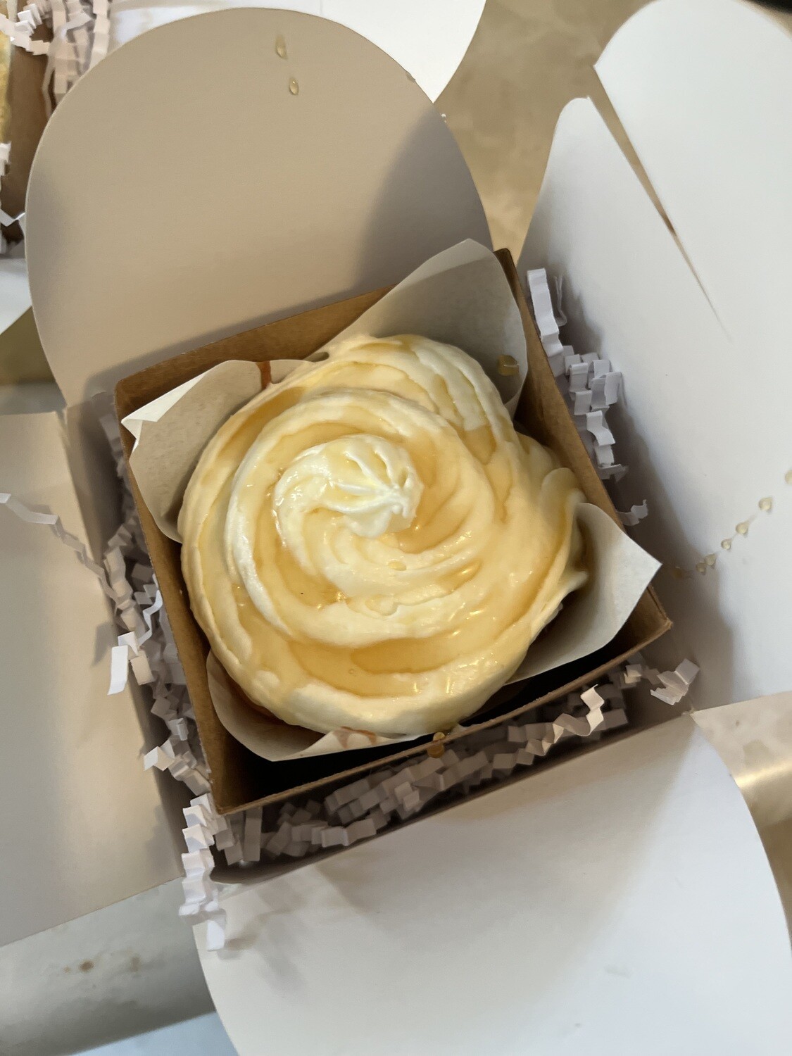 banana cream &amp; vanilla butter-cream cheese icing with vanilla-honey on top; carrot &amp; golden raisins inside cream cheese icing and hand chopped walnuts