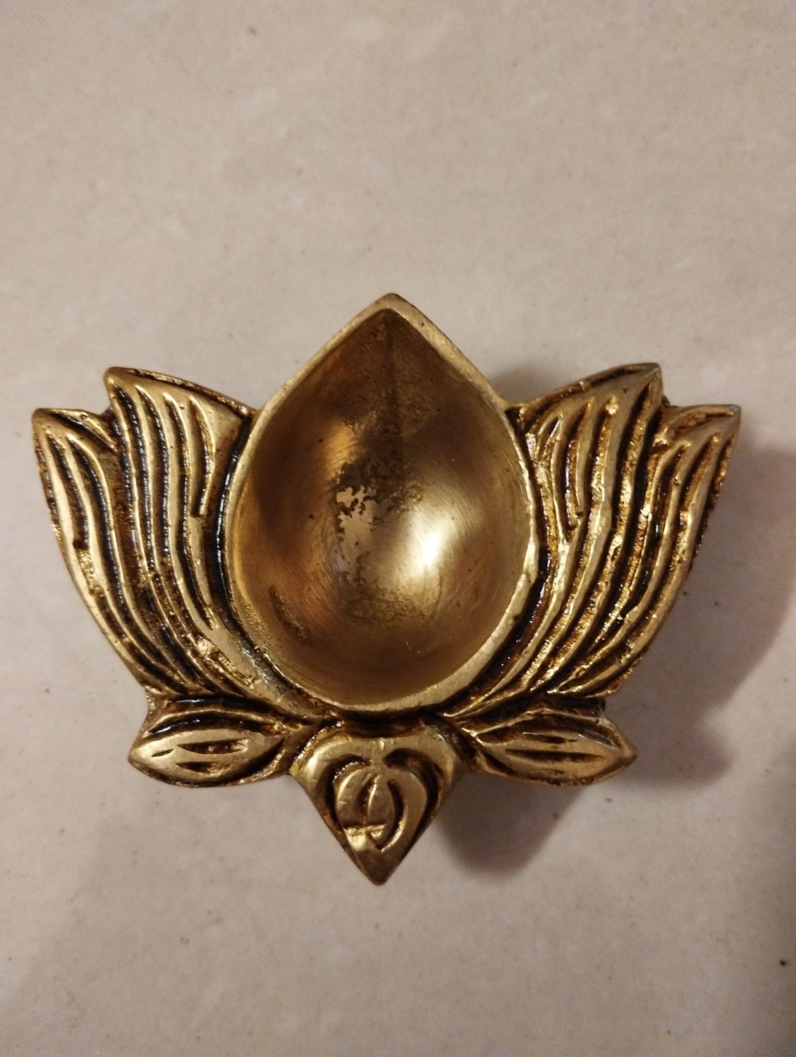 Brass louts diya